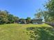 Spacious backyard with an expansive lawn and mature trees at 2601 Windward Ct, Orlando, FL 32805