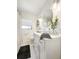 Bright bathroom featuring a stylish vanity, round mirror, and modern fixtures at 2601 Windward Ct, Orlando, FL 32805