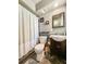 Bathroom with dark fixtures, a modern toilet, and an updated sink at 2601 Windward Ct, Orlando, FL 32805