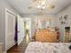 Bedroom featuring wood floors, ceiling fan, and closet at 2601 Windward Ct, Orlando, FL 32805