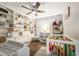 Bedroom with built-in shelving, wood floors, crib, and neutral walls at 2601 Windward Ct, Orlando, FL 32805