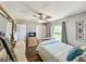 Bright bedroom featuring wood floors, ceiling fan, closet, and natural light at 2601 Windward Ct, Orlando, FL 32805