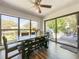 Eat-in dining room with a ceiling fan and large windows offering scenic views at 2601 Windward Ct, Orlando, FL 32805