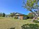 Charming single-story home with brick accents, well-maintained lawn, and mature landscaping at 2601 Windward Ct, Orlando, FL 32805