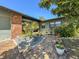 Inviting brick-paved courtyard with vibrant potted plants, creating a charming and colorful entryway at 2601 Windward Ct, Orlando, FL 32805
