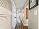 Hallway with wooden floors and white doors at 2601 Windward Ct, Orlando, FL 32805