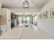 Island view in the kitchen, with stainless steel appliances and open dining area at 2601 Windward Ct, Orlando, FL 32805
