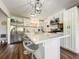 Modern kitchen with stainless steel appliances and a spacious island with seating at 2601 Windward Ct, Orlando, FL 32805