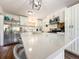 Updated kitchen with a large island, stainless steel appliances, and modern lighting at 2601 Windward Ct, Orlando, FL 32805