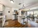 Bright kitchen with white cabinets, an island with seating, and stainless steel appliances at 2601 Windward Ct, Orlando, FL 32805