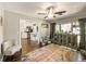Open living room with wood floors and adjacent kitchen at 2601 Windward Ct, Orlando, FL 32805