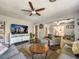 Spacious living room featuring hardwood floors, neutral colors and a view of the adjacent rooms at 2601 Windward Ct, Orlando, FL 32805
