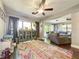 Open living space with hardwood floors, ceiling fans, and abundant natural light at 2601 Windward Ct, Orlando, FL 32805