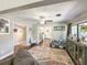 Spacious living room features a large rug and an open layout to the kitchen at 2601 Windward Ct, Orlando, FL 32805