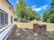 Spacious backyard featuring mature trees and a brick fire pit at 2617 S Marshall Ave, Sanford, FL 32773