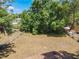 Backyard is fenced and grassy with plenty of shade trees at 2617 S Marshall Ave, Sanford, FL 32773