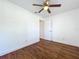 A bedroom featuring wood-look floors, a ceiling fan, and a neutral color palette at 2617 S Marshall Ave, Sanford, FL 32773