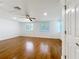 The room is bright and spacious with beautiful wood floors, windows, and a ceiling fan at 2617 S Marshall Ave, Sanford, FL 32773