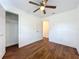 A bedroom featuring wood-look floors and a ceiling fan at 2617 S Marshall Ave, Sanford, FL 32773