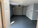 View of a clean, painted garage with an automatic door and ample space for vehicles and storage at 2617 S Marshall Ave, Sanford, FL 32773