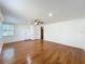 The living room is spacious and well-lit, featuring gleaming hardwood floors and white trim at 2617 S Marshall Ave, Sanford, FL 32773