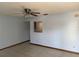 Living room with tile flooring, ceiling fan, and a neutral color palette, offering a bright and airy feel at 2618 Adela Ave, Orlando, FL 32826