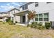 View of backyard, featuring a covered patio and well-maintained landscaping at 2865 High Pointe St, Clermont, FL 34711
