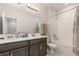 Bathroom features double sinks, gray cabinets, and bath tub shower at 2865 High Pointe St, Clermont, FL 34711