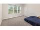 Cozy bedroom with a large window and plush carpeting at 2865 High Pointe St, Clermont, FL 34711