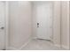 Clean, modern entryway with neutral colors and tile flooring offers a bright and welcoming space at 2865 High Pointe St, Clermont, FL 34711