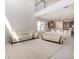 Bright living room boasts high ceilings, tile floors, and modern furniture, creating an inviting space at 2865 High Pointe St, Clermont, FL 34711