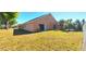 View of the home's backyard featuring a sliding glass door leading to the interior at 3131 Effingham Dr, Clermont, FL 34714
