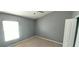 Bedroom with neutral walls, carpeted floors, and abundant natural light at 3131 Effingham Dr, Clermont, FL 34714