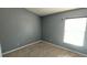 Bedroom bathed in natural light from the window, offering a serene living space at 3131 Effingham Dr, Clermont, FL 34714