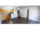 Open-concept living space with the kitchen featuring wood cabinets, stainless steel appliances and breakfast bar at 3131 Effingham Dr, Clermont, FL 34714