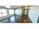 Spacious living area with wood flooring, vaulted ceilings, and neutral paint, providing a blank canvas at 3131 Effingham Dr, Clermont, FL 34714