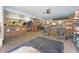 Horse barn with ceiling fan, horse inside stall, and seating area at 3149 Scrub Oak Trl, Oviedo, FL 32765
