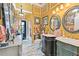 Bathroom featuring double sinks, marble floors, and ornate mirrors at 3149 Scrub Oak Trl, Oviedo, FL 32765