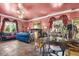 View of the main bedroom featuring a plush bed, seating, and ornate decor at 3149 Scrub Oak Trl, Oviedo, FL 32765