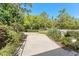 Long driveway leading to property, landscaped on both sides at 3149 Scrub Oak Trl, Oviedo, FL 32765