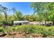 Well-kept equestrian paddock with wooden fencing and a covered shelter, ideal for horse enthusiasts at 3149 Scrub Oak Trl, Oviedo, FL 32765