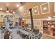 Home gym showcasing full set of workout machines, weights, and custom wall decorations at 3149 Scrub Oak Trl, Oviedo, FL 32765