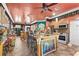 Living space featuring an open kitchen, barstool seating, and an entertainment area at 3149 Scrub Oak Trl, Oviedo, FL 32765