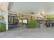 Covered patio with ceiling fans, outdoor furniture, black railing and decorated with potted plants at 3149 Scrub Oak Trl, Oviedo, FL 32765