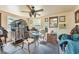 Room with ceiling fan, horse decorations, small table, chairs, and a bird cage at 3149 Scrub Oak Trl, Oviedo, FL 32765