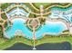 Detailed aerial shot of a luxury resort's pool area, featuring cabanas, lounging areas, and pristine waters at 3192 Caribbean Soul Dr, Kissimmee, FL 34747