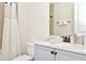 Well-lit bathroom featuring tile flooring, a bath-shower combo, and a vanity with sink and white countertop at 3192 Caribbean Soul Dr, Kissimmee, FL 34747