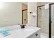 Bathroom featuring a single sink vanity with quartz countertop and a walk-in shower at 3192 Caribbean Soul Dr, Kissimmee, FL 34747