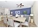 Bright dining area adjacent to the living room, showcasing a modern table and comfortable seating at 3192 Caribbean Soul Dr, Kissimmee, FL 34747