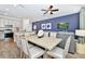 Stylish dining area connected to the kitchen and living room offers a modern open concept design at 3192 Caribbean Soul Dr, Kissimmee, FL 34747